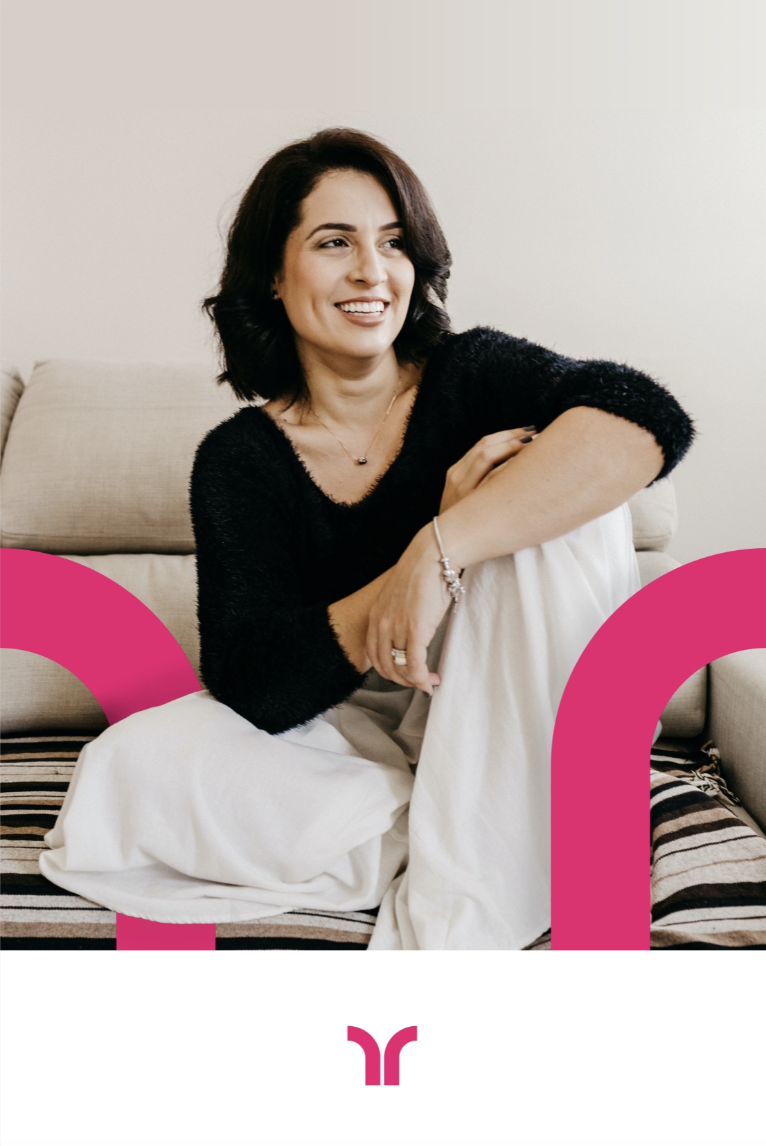 A smiling woman with shoulder-length dark hair sits on a sofa in a black sweater and white pants, framed by pink Tendo arch shapes, with the Tendo mark below.